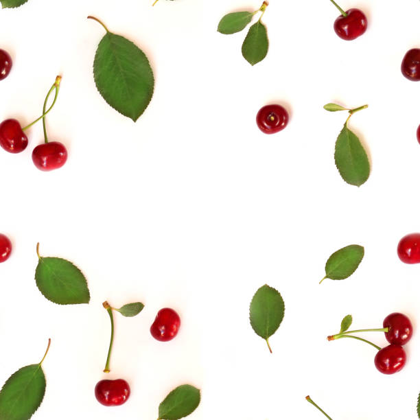 istock Seamless pattern of fruits. Cherry (Latin Prúnus subg. Cérasus). Isolated on white background, top view, flat lay. Can be used for wallpapers and packaging. 985144596