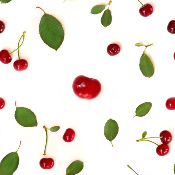 istock Seamless pattern of fruits. Cherry (Latin Prúnus subg. Cérasus). Isolated on white background, top view, flat lay. Can be used for wallpapers and packaging. 985146716