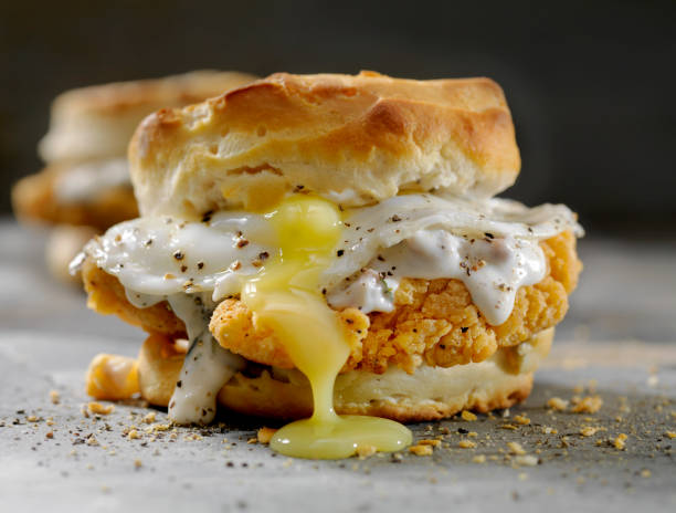 istock Fried Chicken Sandwich with a Fried Egg,Sausage Gravy on a Biscuit 985148176