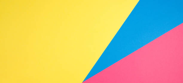 istock Color papers geometry flat composition background with yellow, pink and blue tones 985158356
