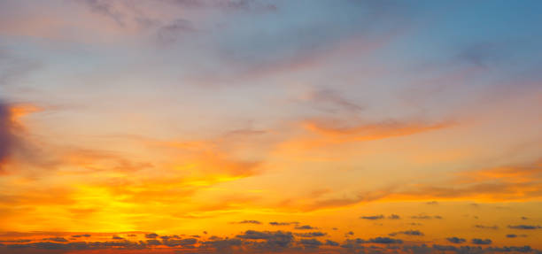 istock Cloudy sky and bright sunrise over the horizon. 985158362
