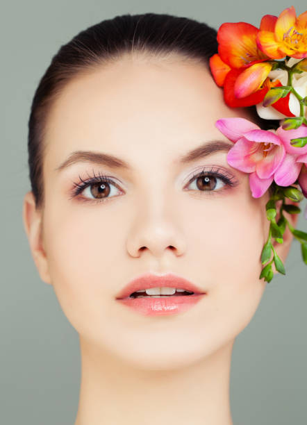 istock Spa Woman Face with Flowers 985159256
