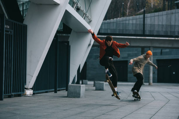 istock young men riding skateboards in urban location 985162408