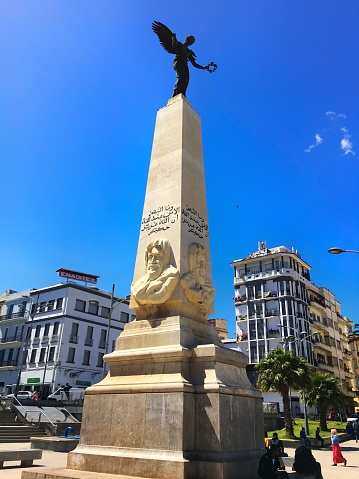 Premier Novemver 1954 Square, Oran, Algeria - April 1, 2017: Sidi Brahim la Gloire Ailee Monument with the angel statue in the old square.