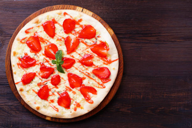 istock strawberry pizza flat lay with free space 985166022