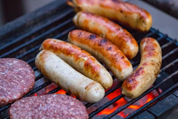 istock Assorted mixed grill from chicken meat, and pork, sausages  roasting on barbecue grid cooked for summer family dinner 985170688