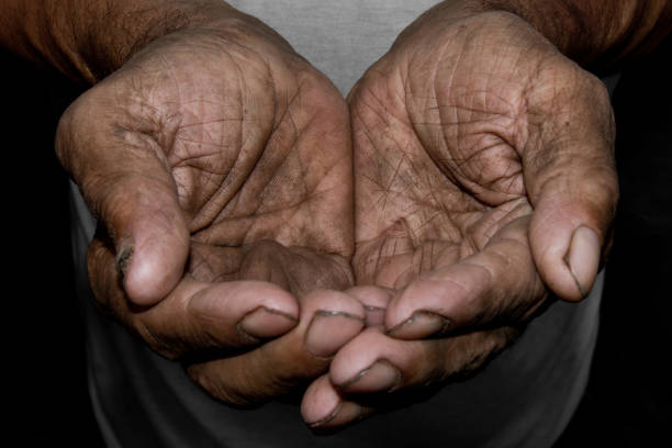 The poor old man's hands beg you for help. The concept of hunger or poverty. Selective focus. The poor old man's hands beg you for help. The concept of hunger or poverty. Selective focus. Poverty in retirement. Alms victim advocacy stock pictures, royalty-free photos & images