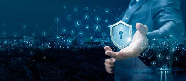 Businessman showing a shield of protection network.