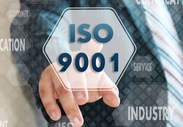 istock The businessman chooses ISO 9001,  presses a button on the touch screen 985184338