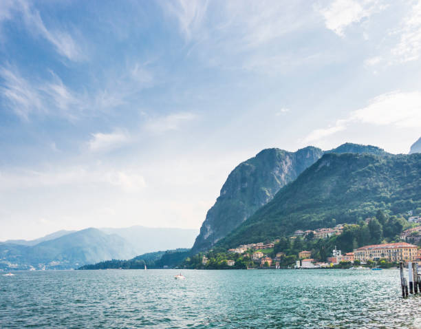 Como lake, Como city, northern Italy. View of Lake Como by the end of the lakefront promenade of Como town. Stock image.