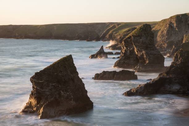 istock Stunning dusk sunset landscape image of Bedruthan Steps on West Cornwall coast in England 985191230
