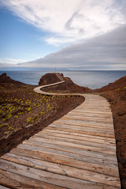 Road to the Lighthouse Wooden Road to the Teno Lighthouse. Tenerife. Canary Islands. Spain. teno mountains photos stock pictures, royalty-free photos & images