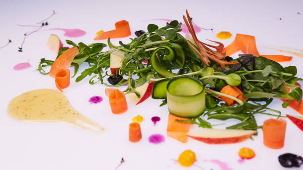 istock Mix fresh leaves of arugula, lettuce, spinach, beets for salad on a white background. Selective focus 985232230