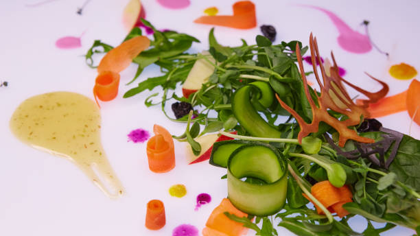 istock Mix fresh leaves of arugula, lettuce, spinach, beets for salad on a white background. Selective focus 985232252
