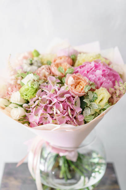 istock beautiful spring bouquet. flower arrangement with hydrangea and peonies. Color light pink. The concept of a flower shop, a small family business 985237882