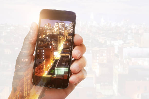 istock Hand photographing city with cellphone 985238050