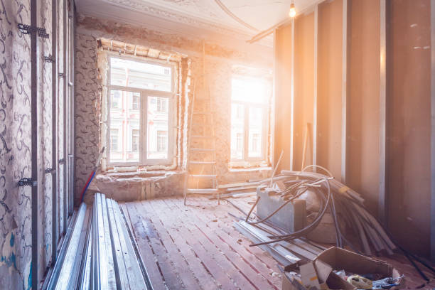 istock Working process of installing pvc windows and metal frames for plasterboard - drywall and construction tools in room of apartment is under construction, remodeling, renovation, extension, restoration and reconstruction 985238524
