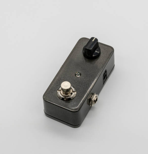 istock Dark grey guitar pedal isolated on white background 985246108