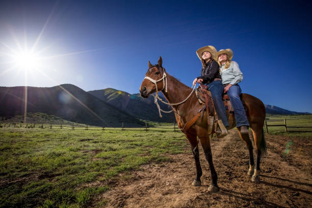 istock Two Cowgirls Riding Pillion 985246566