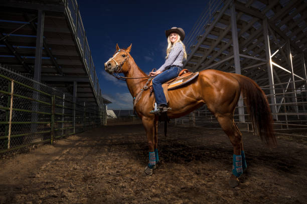 istock Cowgirl on Horseback Under Rodeo Stands 985246744