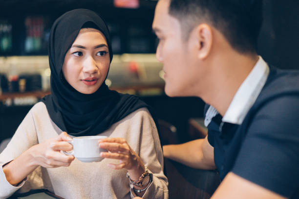 istock Muslim couple having coffee and chatting 985249044
