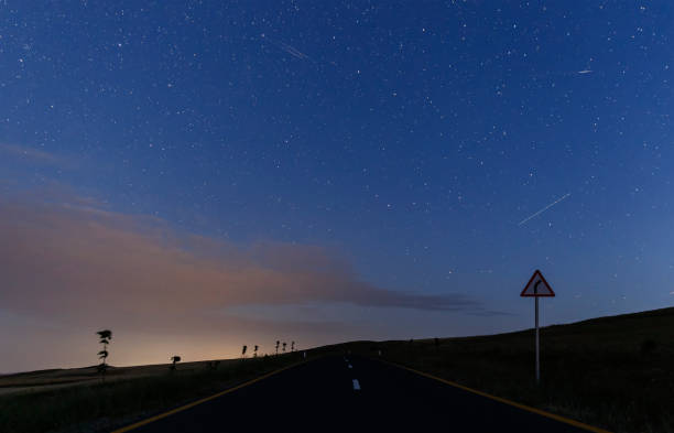 istock New asphalt road and starry sky 985256054
