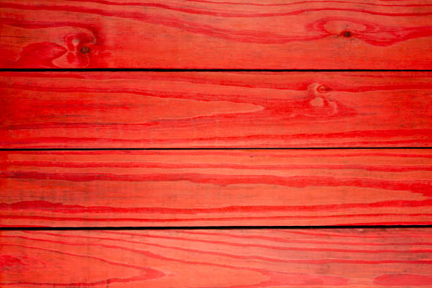 istock Wood pinus painted red - abstract background 985262324