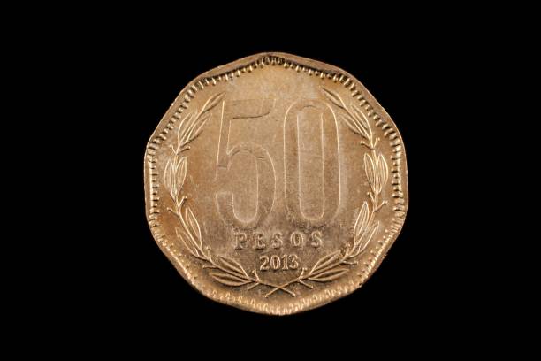 istock Chilean 50 Peso Coin Isolated On A Black Background 985263458