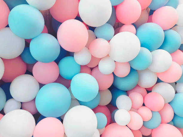 istock Many colorful balloons decorated wall as background 985265654