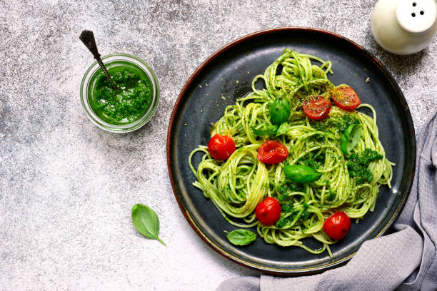 istock Spaghetti pasta with pesto sauce and cherry tomatoes 985266204