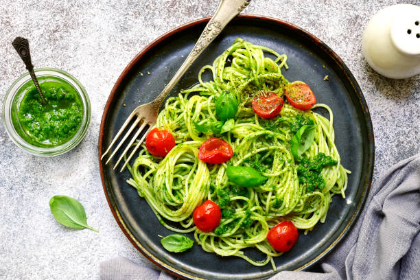 istock Spaghetti pasta with pesto sauce and cherry tomatoes 985266270