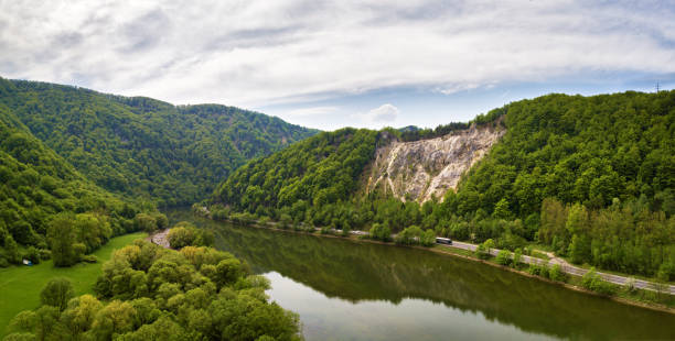 istock Wild river in mountain valley. Green mountain 985273912