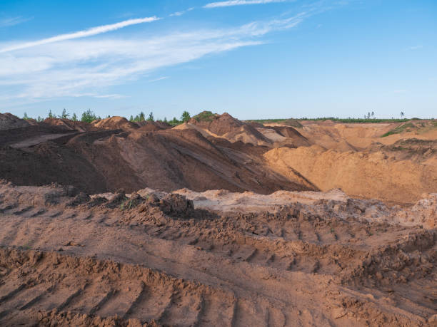 istock Industrial sand quarry or pit landscape. Construction industry. Sand hills background 985280754