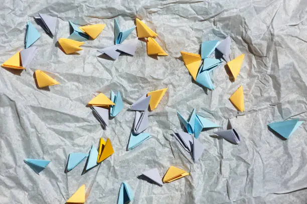 Origami blanks. creativity, handwork. Paper origami composition flat lay, space for a tex, top view