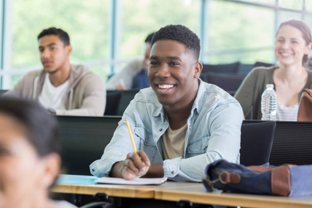 istock Attentive male college student in class 985296064