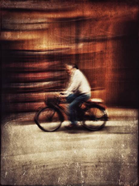 istock Blurred motion view of a man on bicycle 985305164