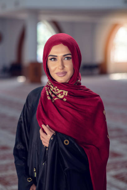 istock young woman wearing hijab posing at mosque 985347030