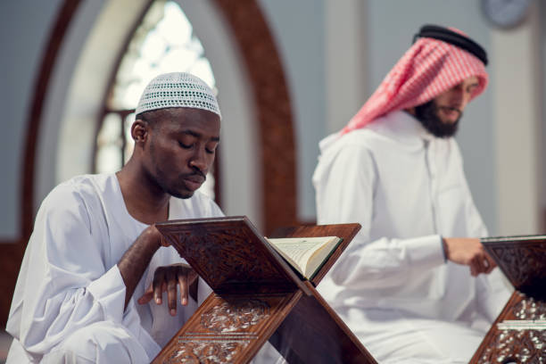 istock Two religious muslim man praying together inside the mosque 985355612