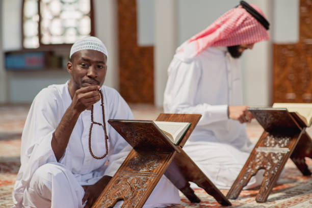 istock Two religious muslim man praying together inside the mosque 985358404
