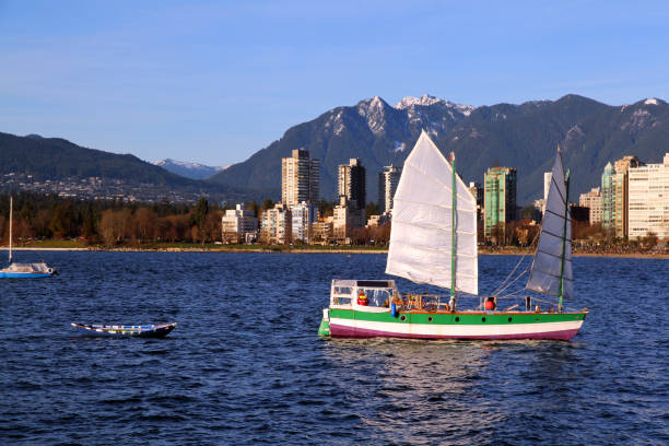 Hauling A junk in harbor in English Bay, Vancouver, Canada. beach english bay vancouver skyline stock pictures, royalty-free photos & images