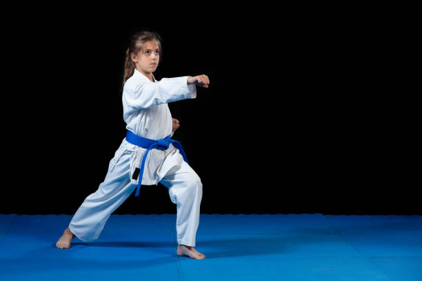 istock young girl in a white kimono, karate 985368008