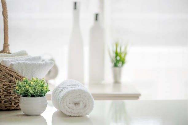 istock White towels on white table with copy space on blurred bathroom background. 985388528