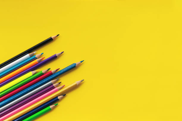 istock Community communication concept. Group of pencils on the yellow background with copy space 985408420