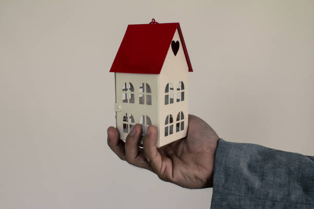 istock Home ownership concept.  Symbolizing purchasing a home for buying or renting. 985409352