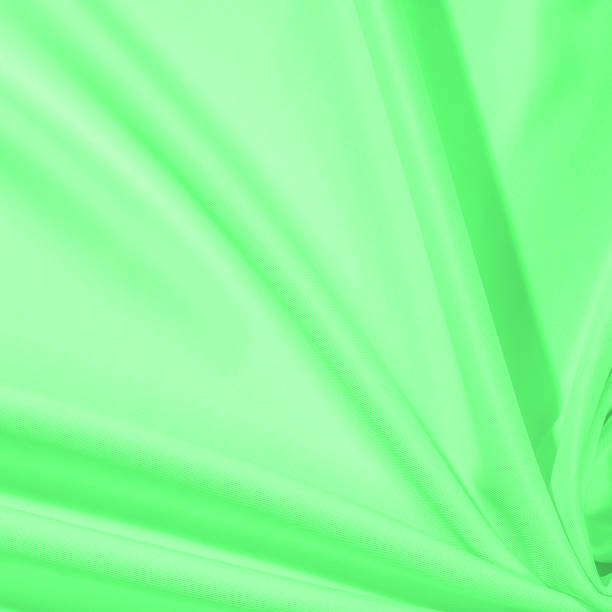 istock Texture. Background. Template. Cloth - silk green. Known extravagance, this Green silk taffeta is nothing more than a word. Luminous light green fabric is a crispy hand, inherent in tafeta. 985428320