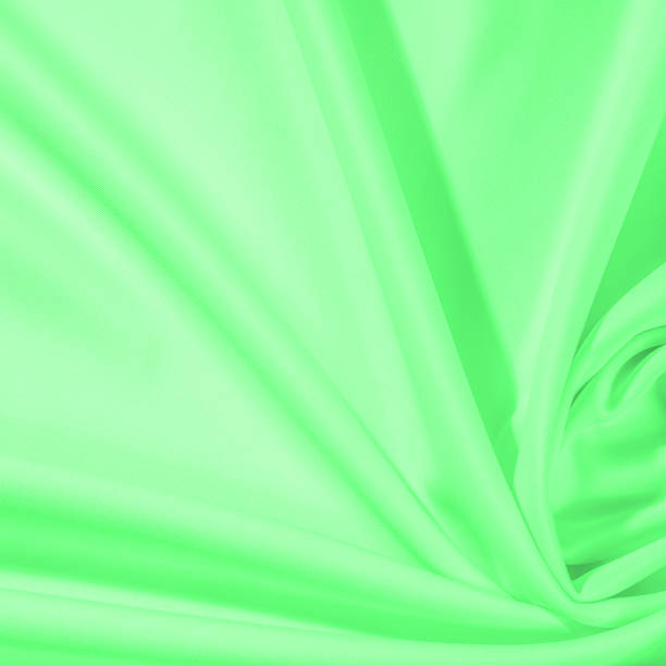 istock Texture. Background. Template. Cloth - silk green. Known extravagance, this Green silk taffeta is nothing more than a word. Luminous light green fabric is a crispy hand, inherent in tafeta. 985428346