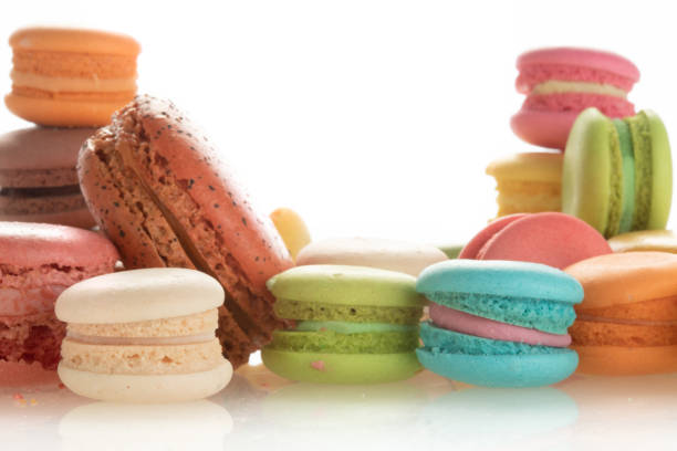 istock Colourful french macarons on white background 985429632