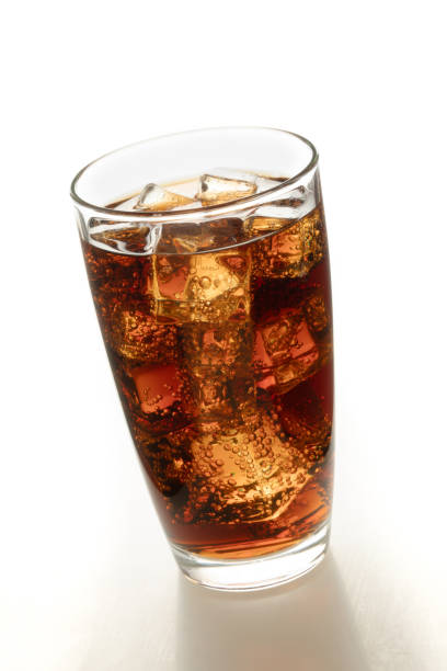 istock Cola in glass with ice . 985429706