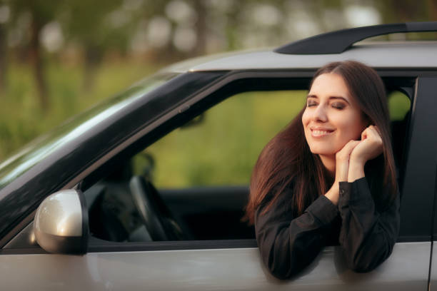 istock Happy  Female Driver on a Summer Vacation Road Trip 985458634