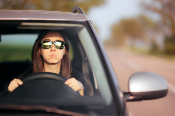 istock Stressed Female Driver on a Summer Vacation Road Trip 985458690